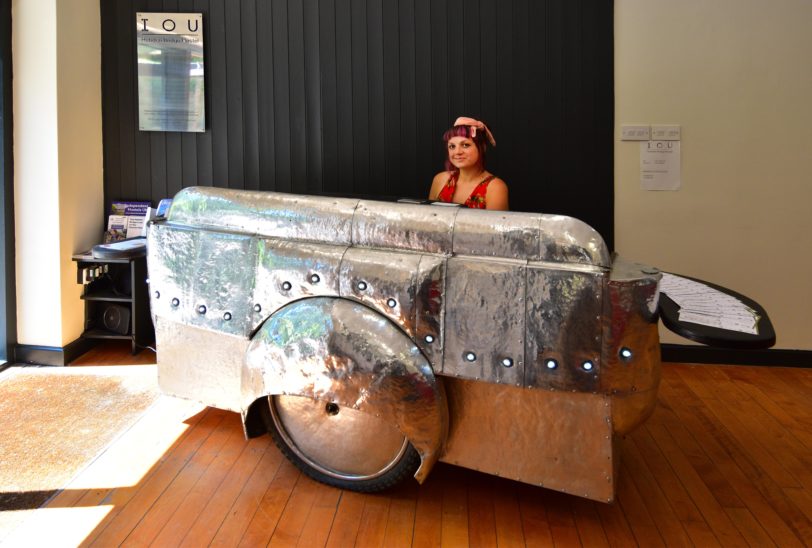 silver reception desk with woman working